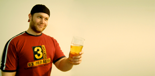 Beer Lover A man holding a glass of beer