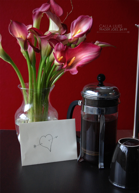 setup calla lilies Trader Joes $4.99 with calla lilies in a vase with a letter in an envelope and pressed coffee all set on a table