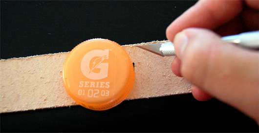 trim Use a Gatorade cap as a template for cutting the end of the belt