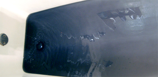 shrink to fit Levi's 501 Shrink to Fit inky water from indigo dye from soaking jeans