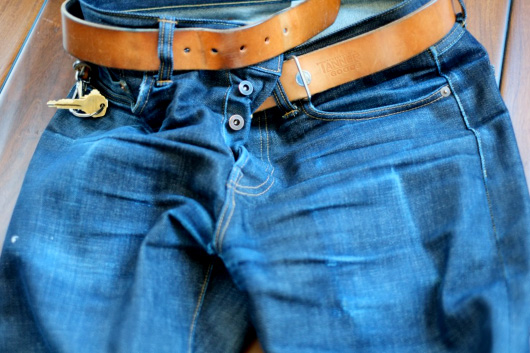 Teleson A pair of worn selvedge denim jeans with belt