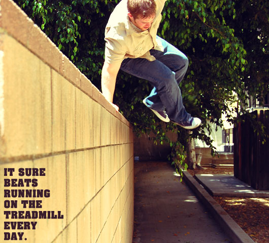 A man jumping over a wall