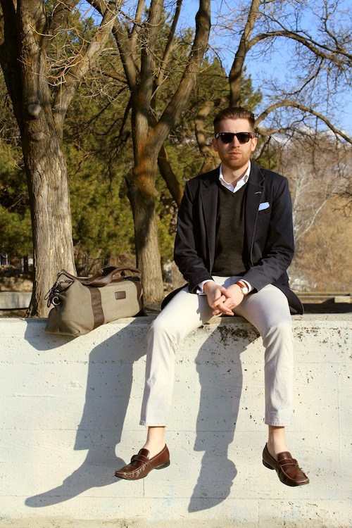 Tanner Guzy sitting on a wall