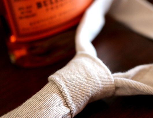 A close up of a tie knot