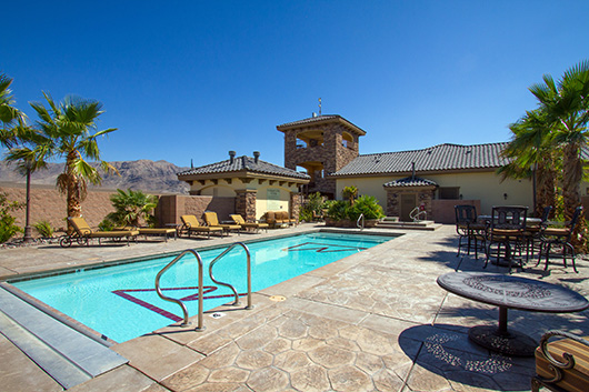 A group of chairs sitting next to a pool