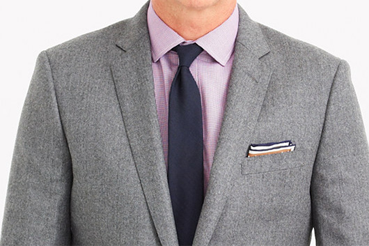 A man wearing a suit and tie