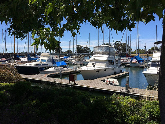 A boat is docked next to a body of water