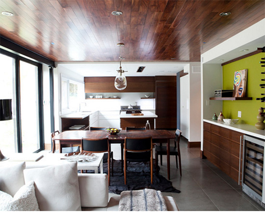 A living room filled with furniture with a wooden ceiling