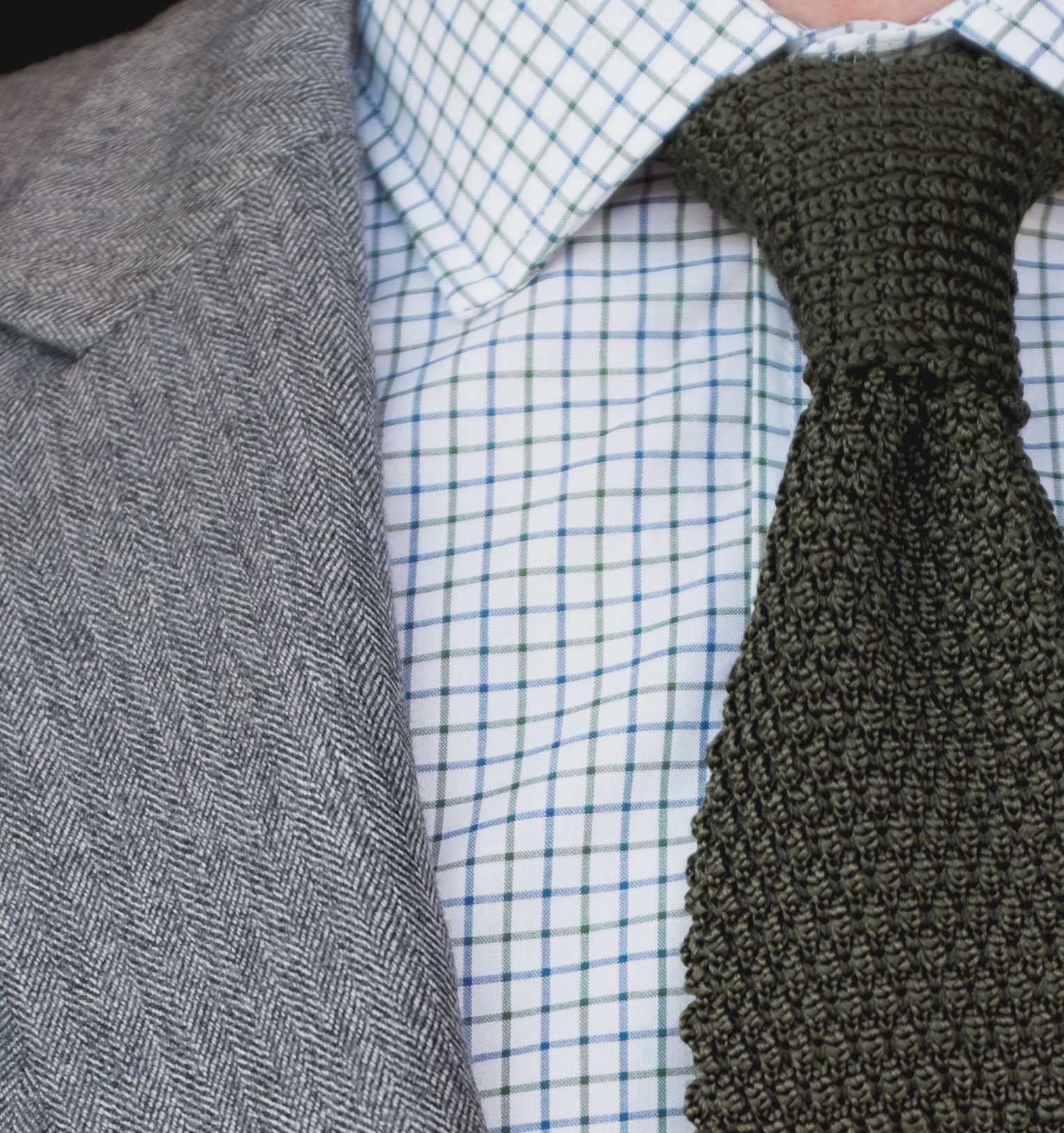 Indochino Herringbone suit with knit tie