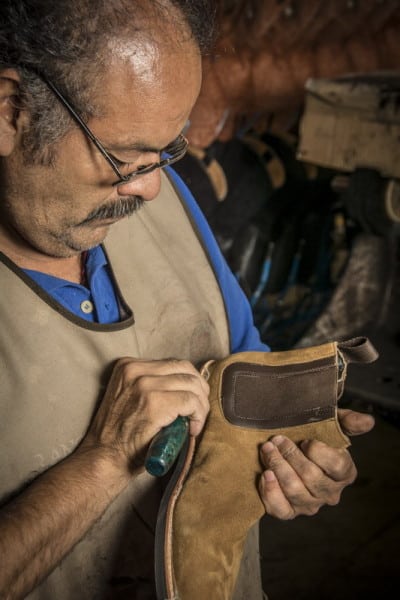 A craftsman in a Leon, Mexico factory hand builds a Thursday boot