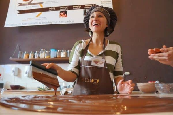 Woman makes chocolate in a class