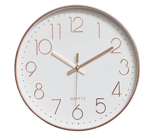 A close up of a gold clock