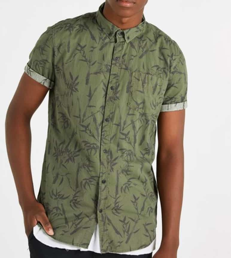 A man wearing a green shirt