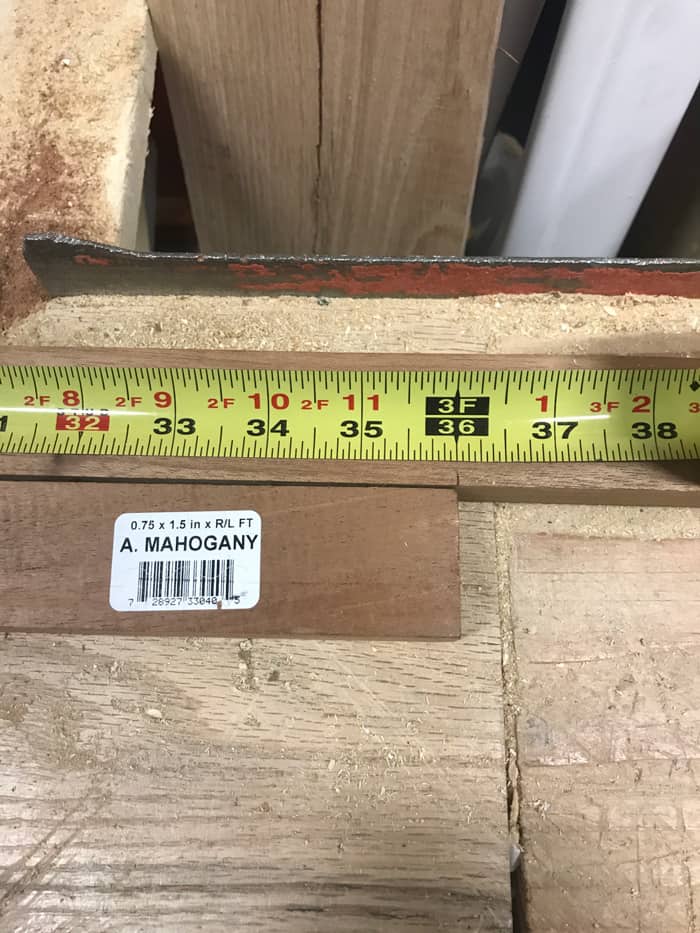 Close up of a measuring tape and wood