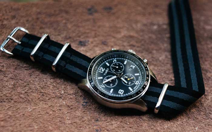 A close up of a watch on a nato strap