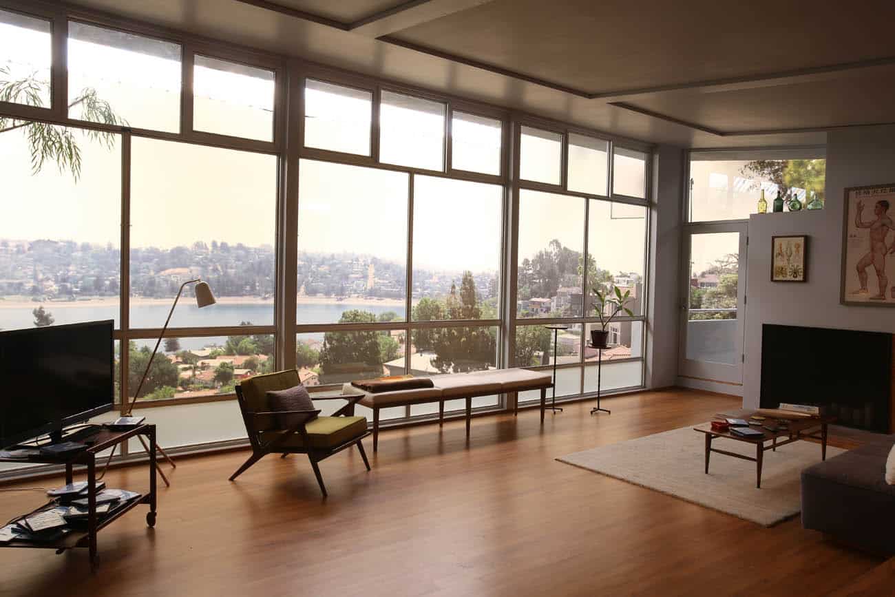 A living room filled with furniture and a large window