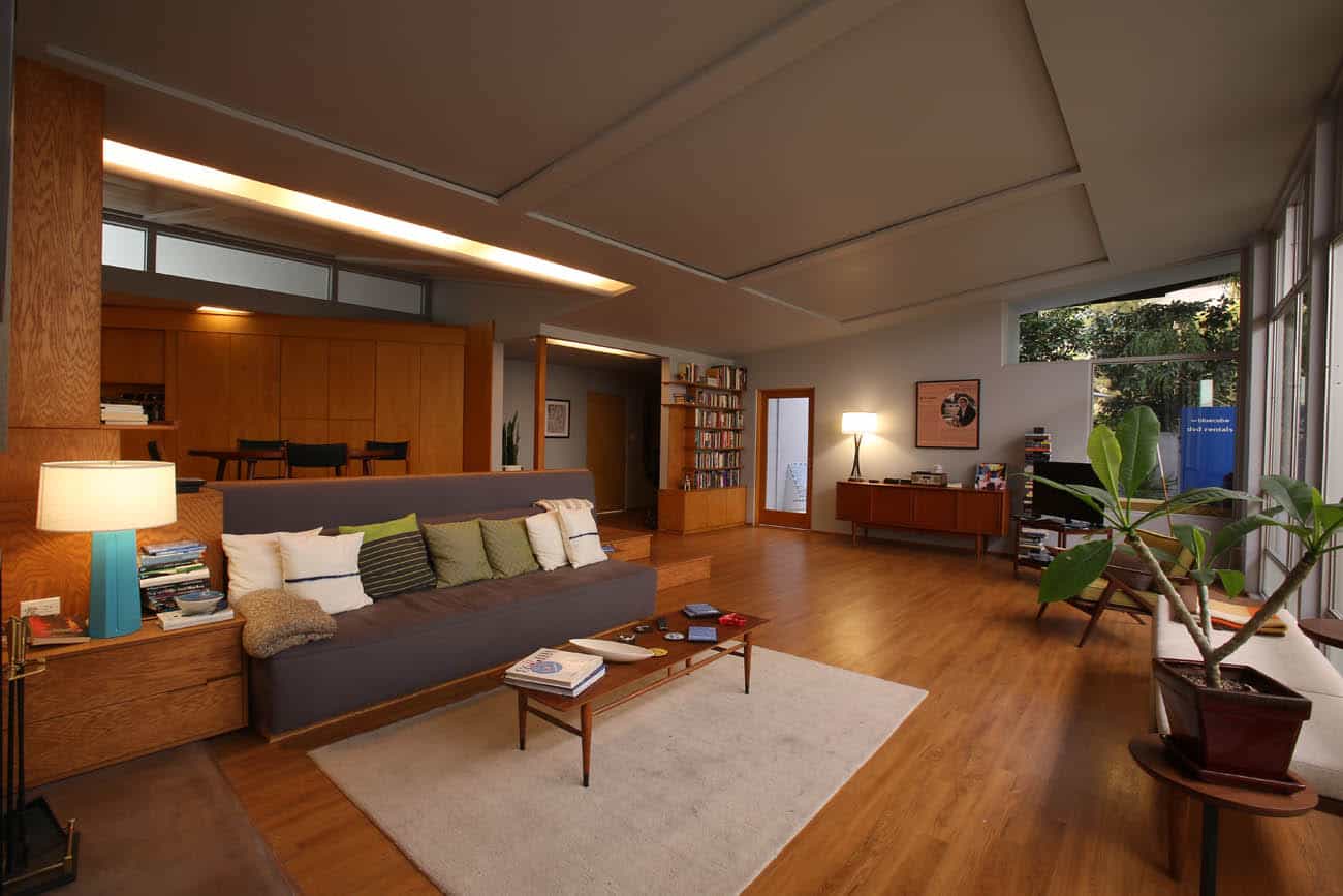 A living room filled with furniture with wood accents