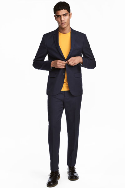 A man wearing a suit sweater