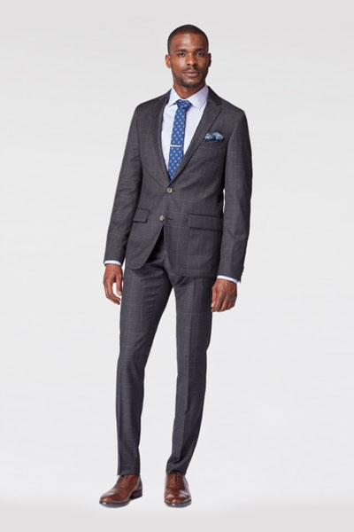 A man wearing a prince of wales suit