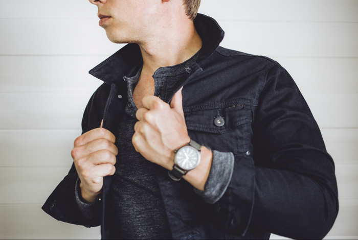 a man wearing a black denim jacket from Zara over a shirt