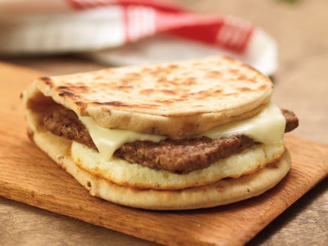 Image of dunkin donuts turkey sausage flatbread breakfast sandwich