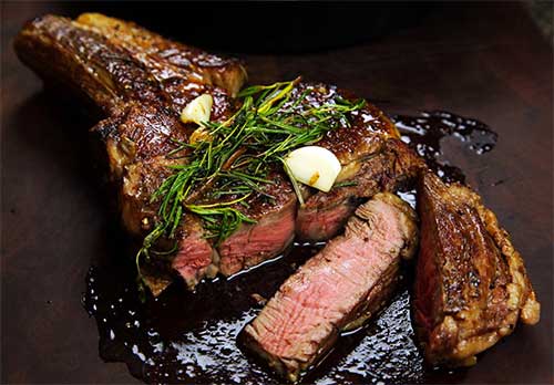 pan seared ribeye with butter and rosemary cooked medium rare