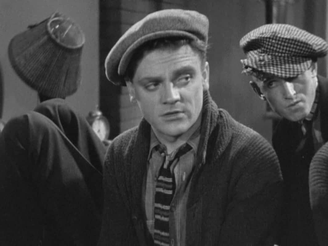 James Cagney wearing a hat and knit tie