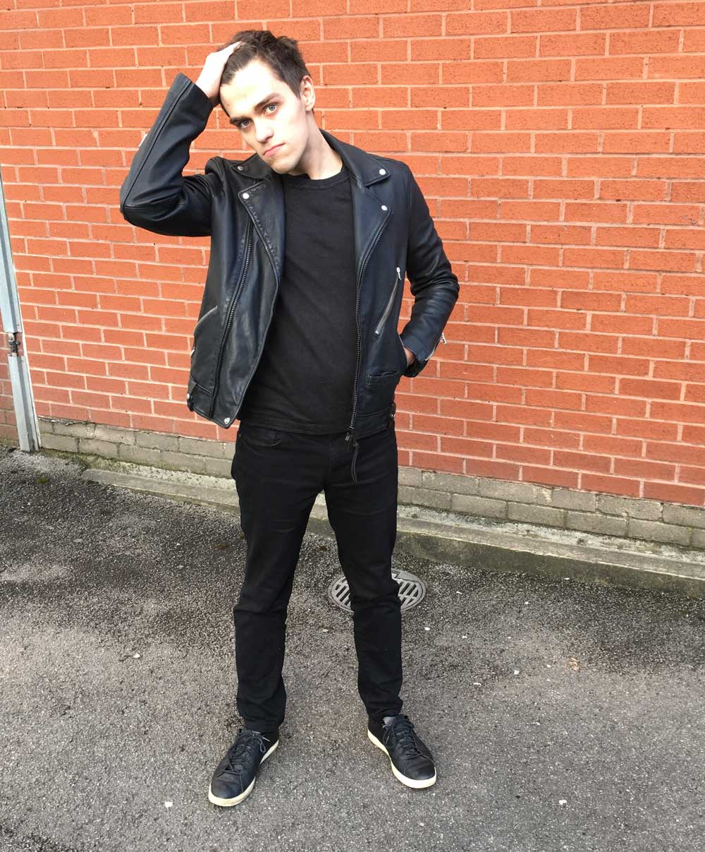 Zac Silk wearing a black outfit