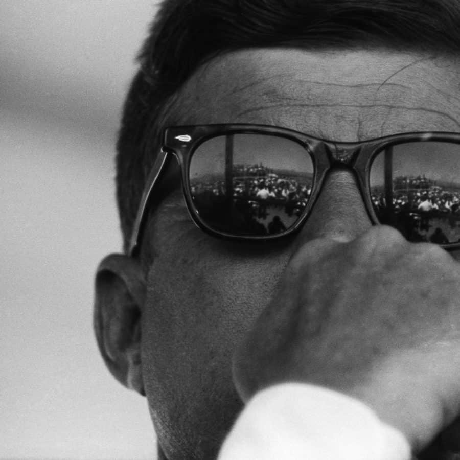 A close up of John F. Kennedy wearing sunglasses