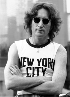 John Lennon posing for the camera