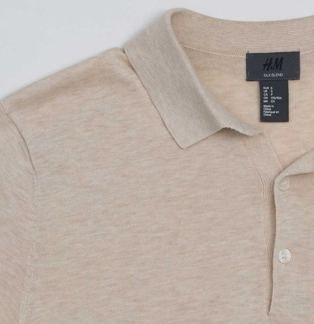 A cream colored polo shirt