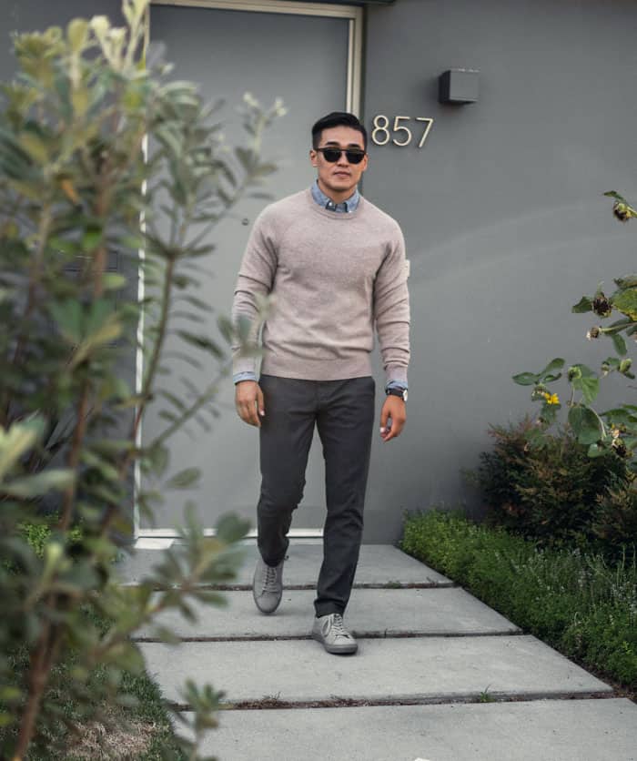 man wearing smart casual outfit with gray sneakers