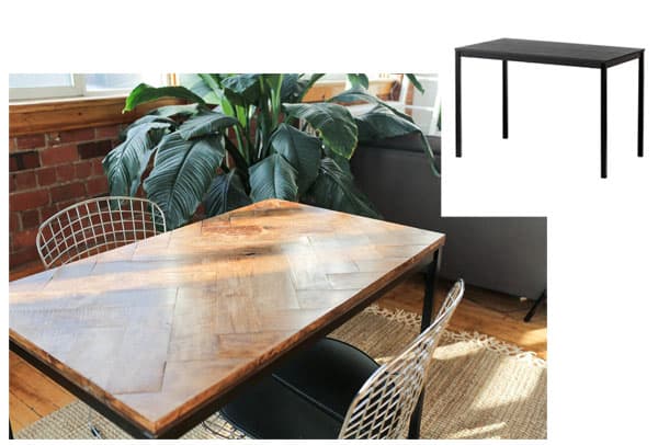 A table and chairs with plant