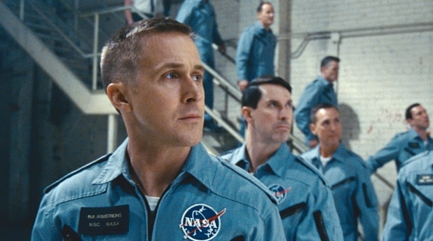 Ryan Gosling standing in front of astronauts