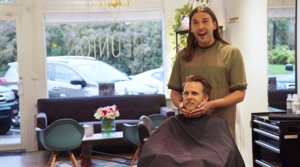 Jonathan van ness grooming a man in a chair