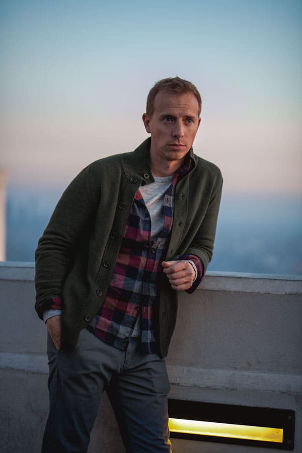 men outfit green moc neck sweater flannel shirt gray chinos