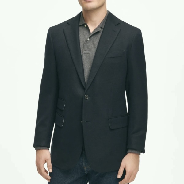 man wearing a slim fit wool hop sack blazer over a button front shirt