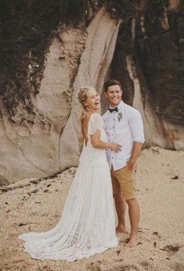 groom wearing shorts at wedding