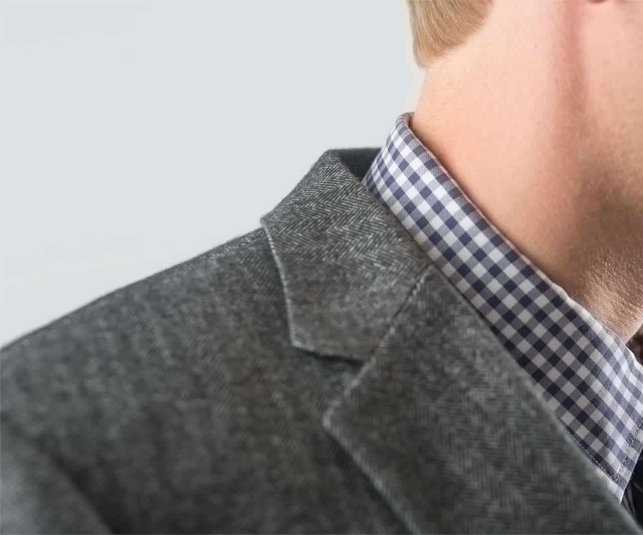 Close up showing collar gap between suit and shirt collar
