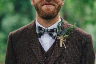 A man wearing a suit and bow tie
