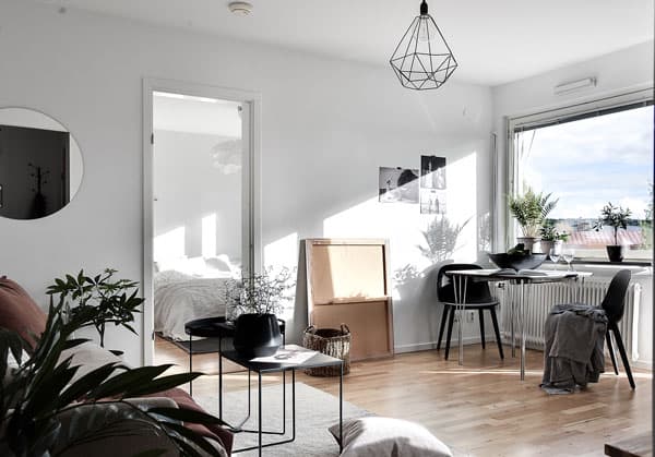 A living room filled with furniture and a large window