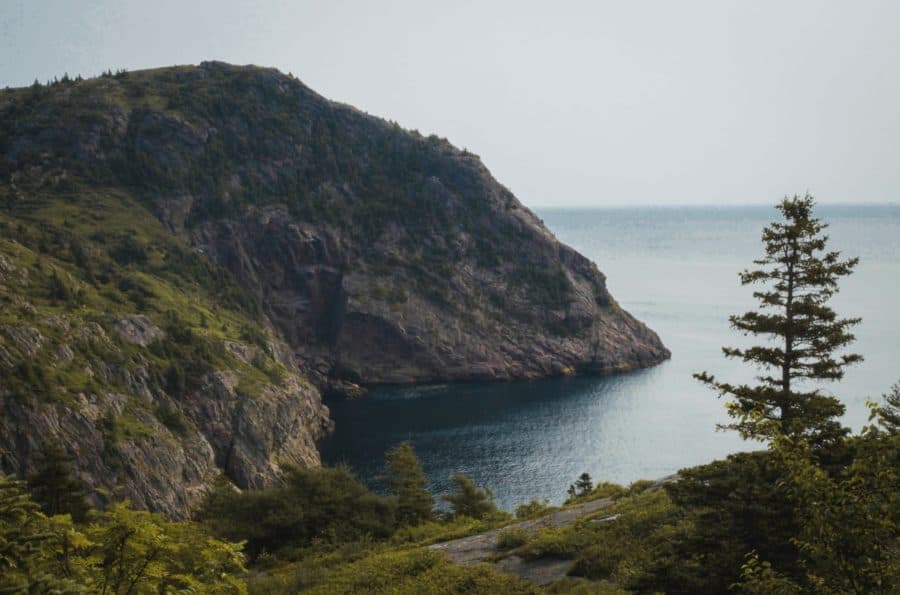 GMC7 A body of water with a mountain in the background