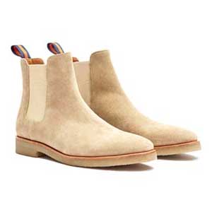 A close up of a suede chelsea boots