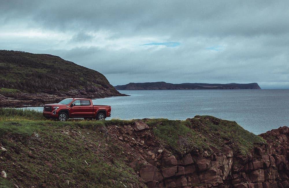 A truck next to body of water