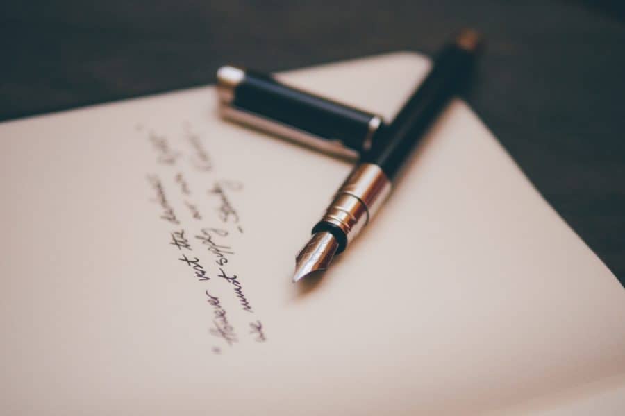 Image of fountain pen on stationary photo by Álvaro Serrano