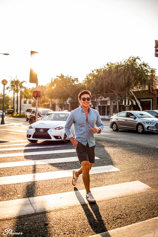 A man running across the street wearing Peter Manning