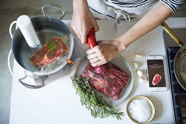 a person using a sous vide machine