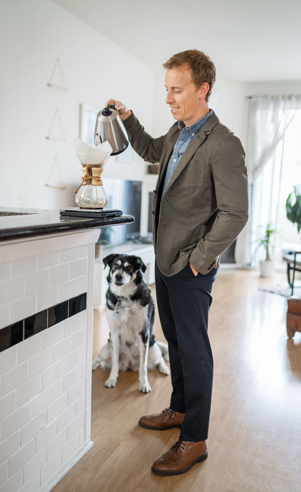 green twill blazer chambray shirt black dress pants brown shoes men work outfit making coffee