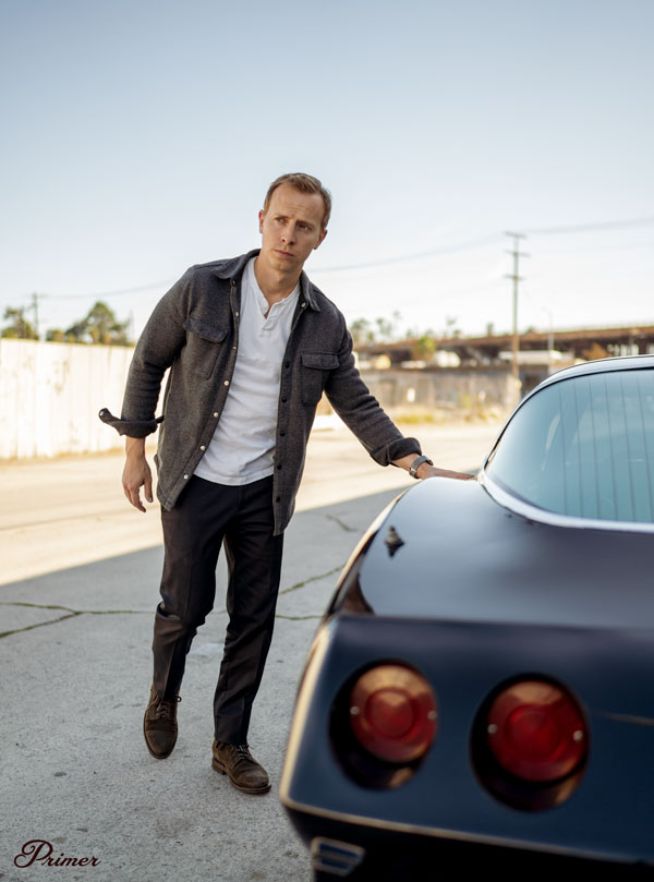 black khaki pants, shirt jacket, white henle, suede boots men outfit
