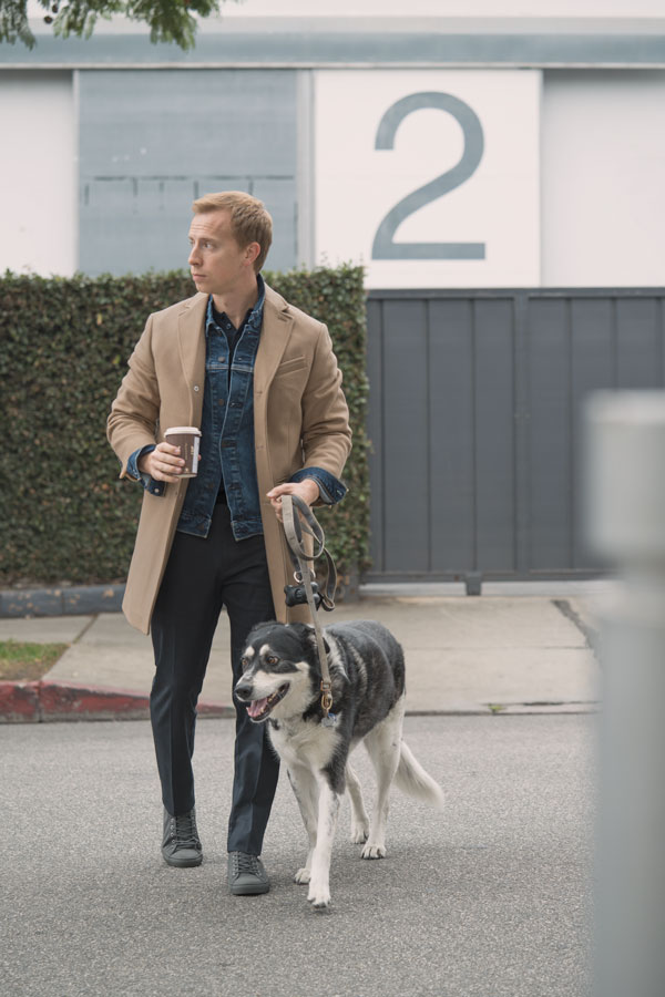 camel topcoat, black pants, denim jacket, gray sneakers men outfit